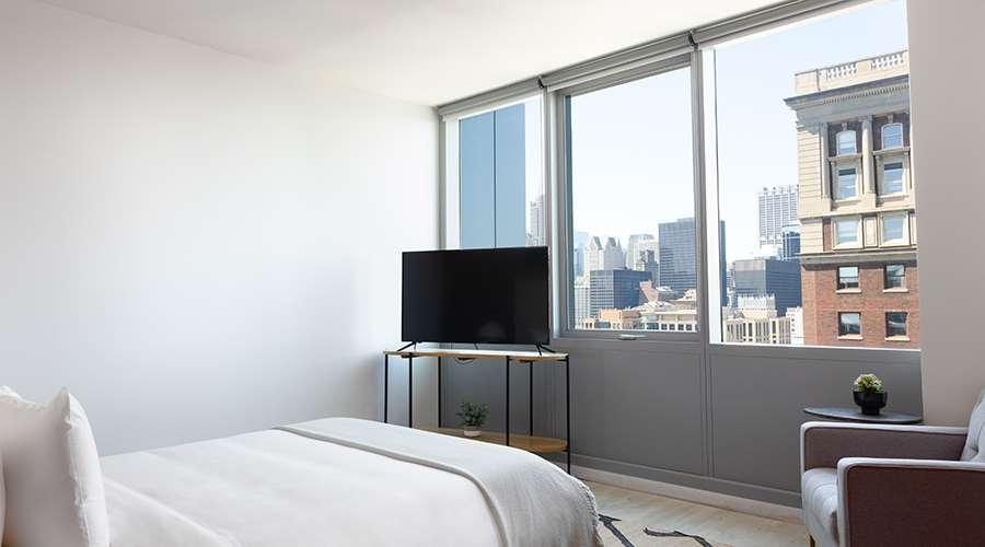 Aparthotel Sentral Michigan Avenue Chicago Camera foto A bedroom at 100 East 14th Street
